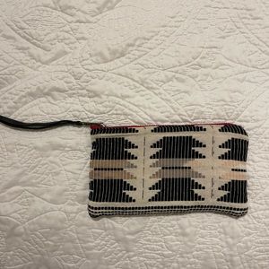 Woven and leather clutch